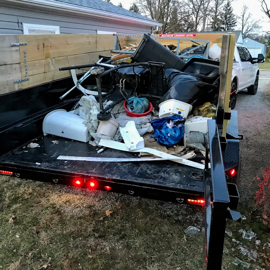 Roll-off dumpster delivered to a residential driveway in Topsham