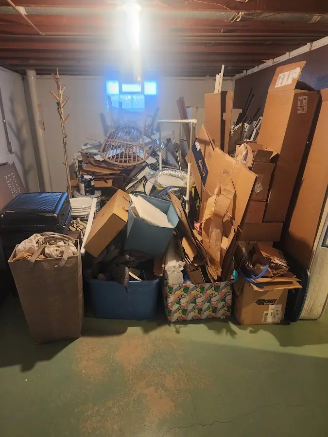 Roll-off dumpster container at job site for 2 Yard Dumpster Rental in Topsham