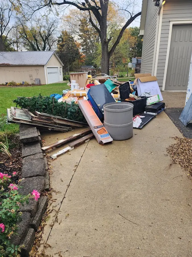 Dumpster being loaded with debris for 10 Yard Dumpster Rental in Topsham